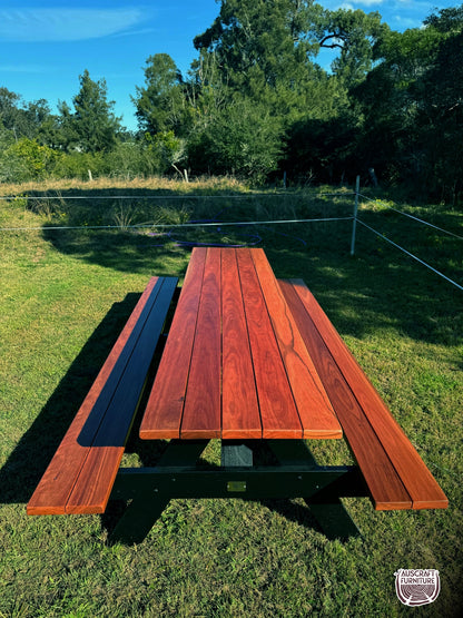 Outdoor hardwood picnic table featuring strong black legs, ideal for Australian gardens, patios, cafés and high-traffic commercial areas