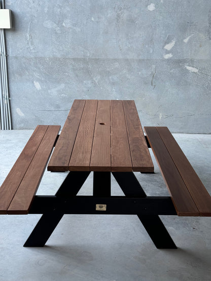 Outdoor picnic table featuring a matte walnut top and black legs, ideal for Sydney homes, cafés and commercial outdoor spaces
