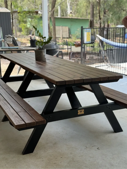 Premium walnut picnic table with black frame, ideal for resort gardens, terraces, and guest relaxation spaces in Australia