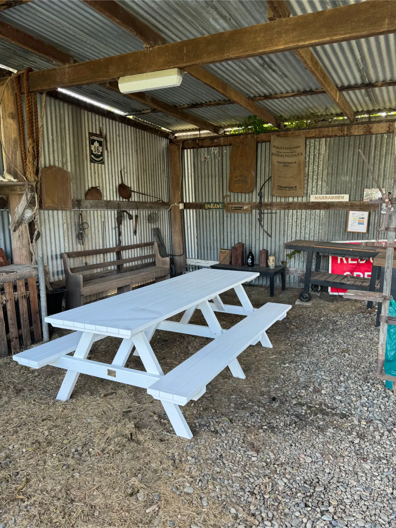 Elegant white picnic table creating a light and welcoming feel in home garden settings across Australia