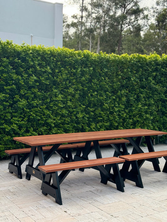 Varnished hardwood outdoor table set with black frame for modern outdoor spaces and commercial use in Australia