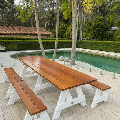 Hardwood outdoor table set with white legs and varnished timber finish