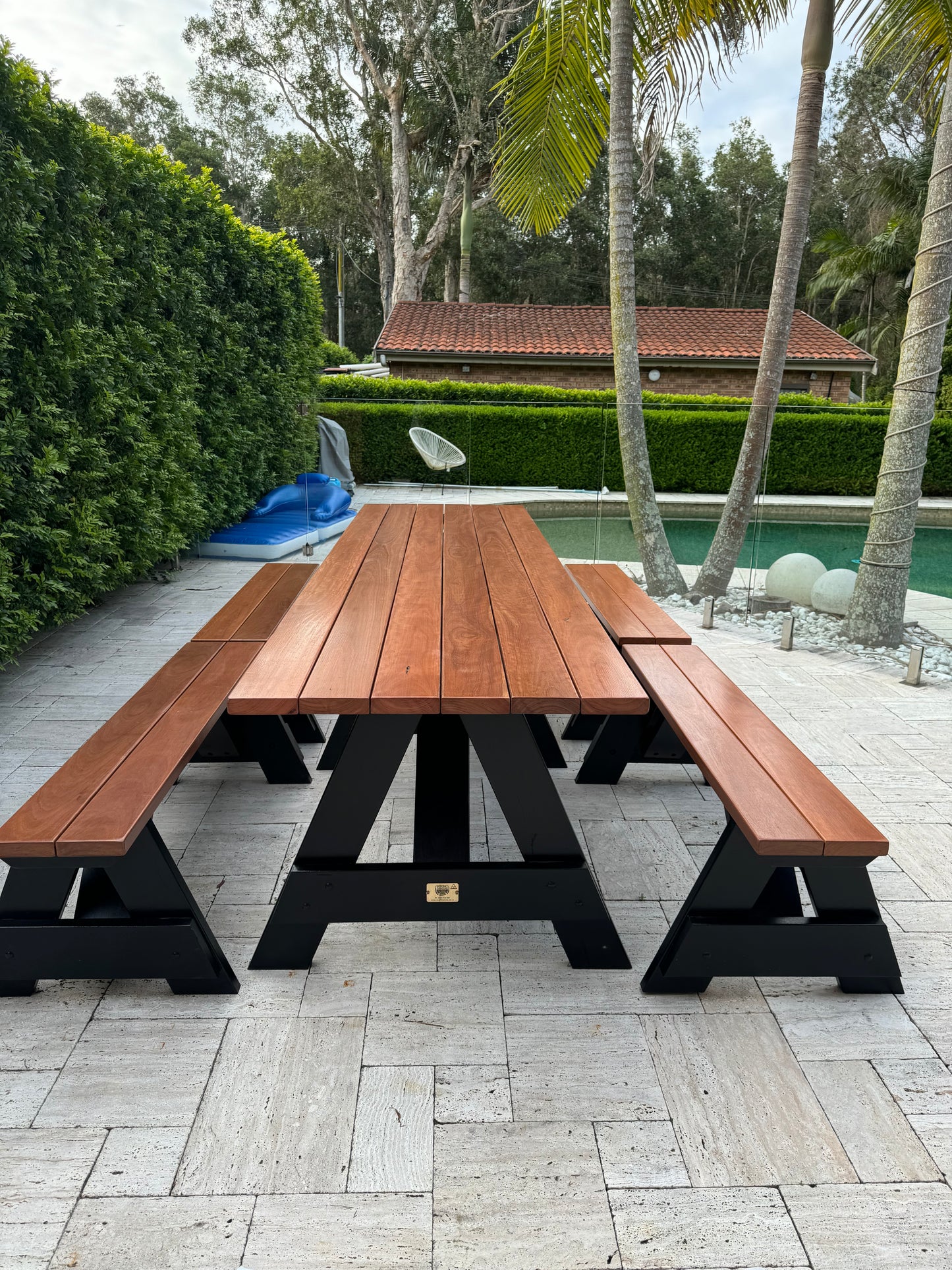 Hardwood picnic table with black legs for hotel gardens and resort outdoor guest areas in Australia