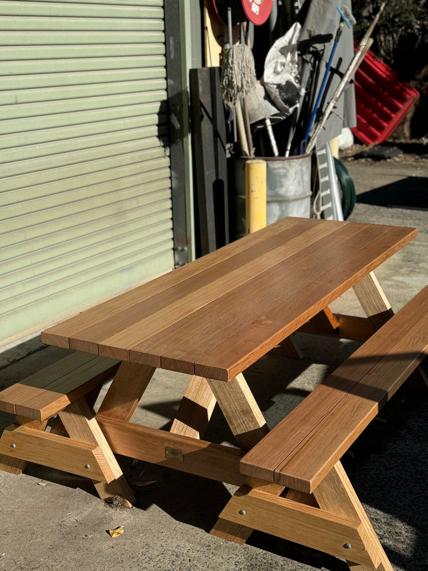 Raw hardwood picnic table designed for shared courtyards in residential and mixed-use property developments in Australia