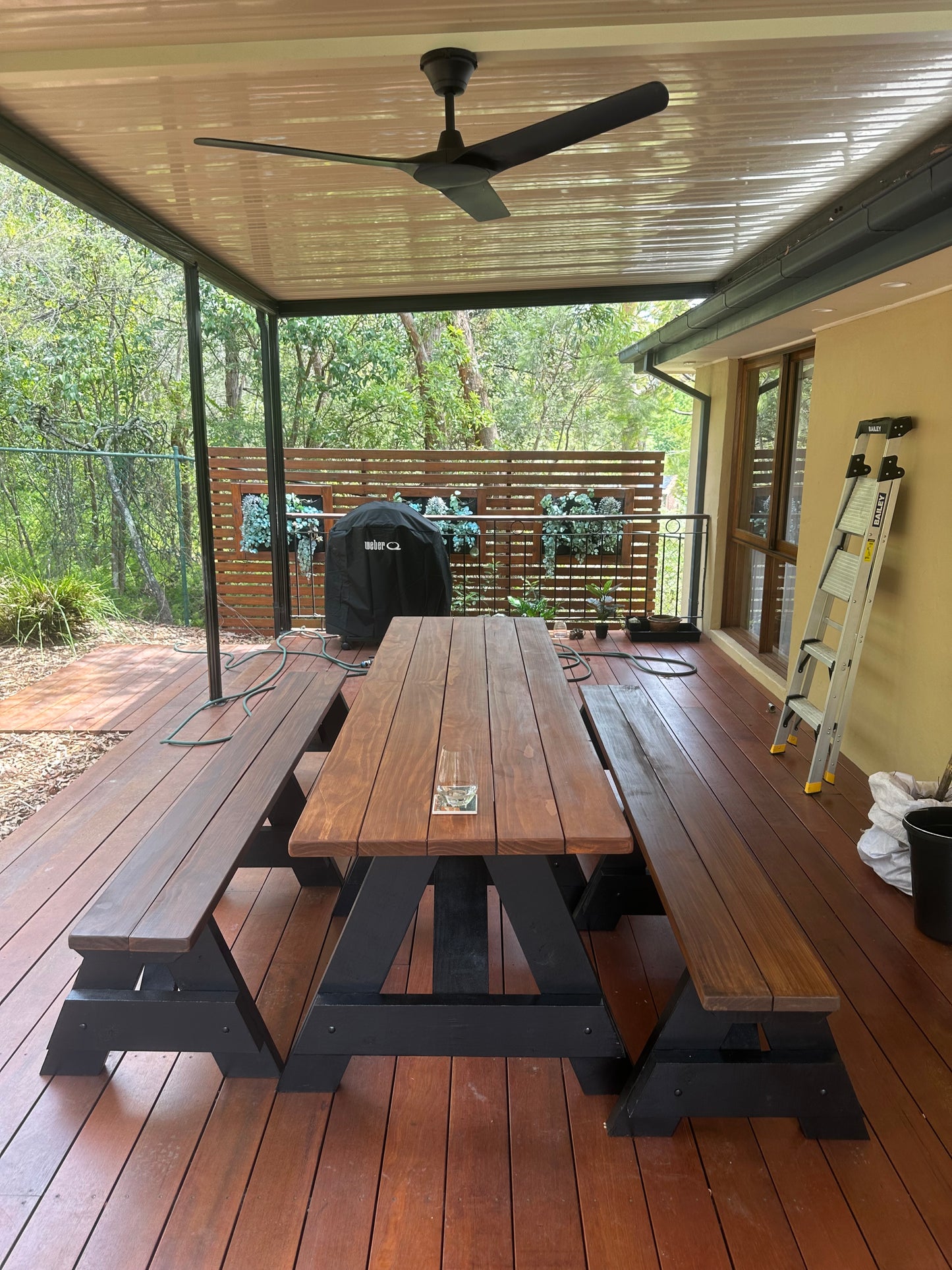 Custom stain heavy-duty outdoor table with black legs for cafe terraces and alfresco seating spaces in Australia