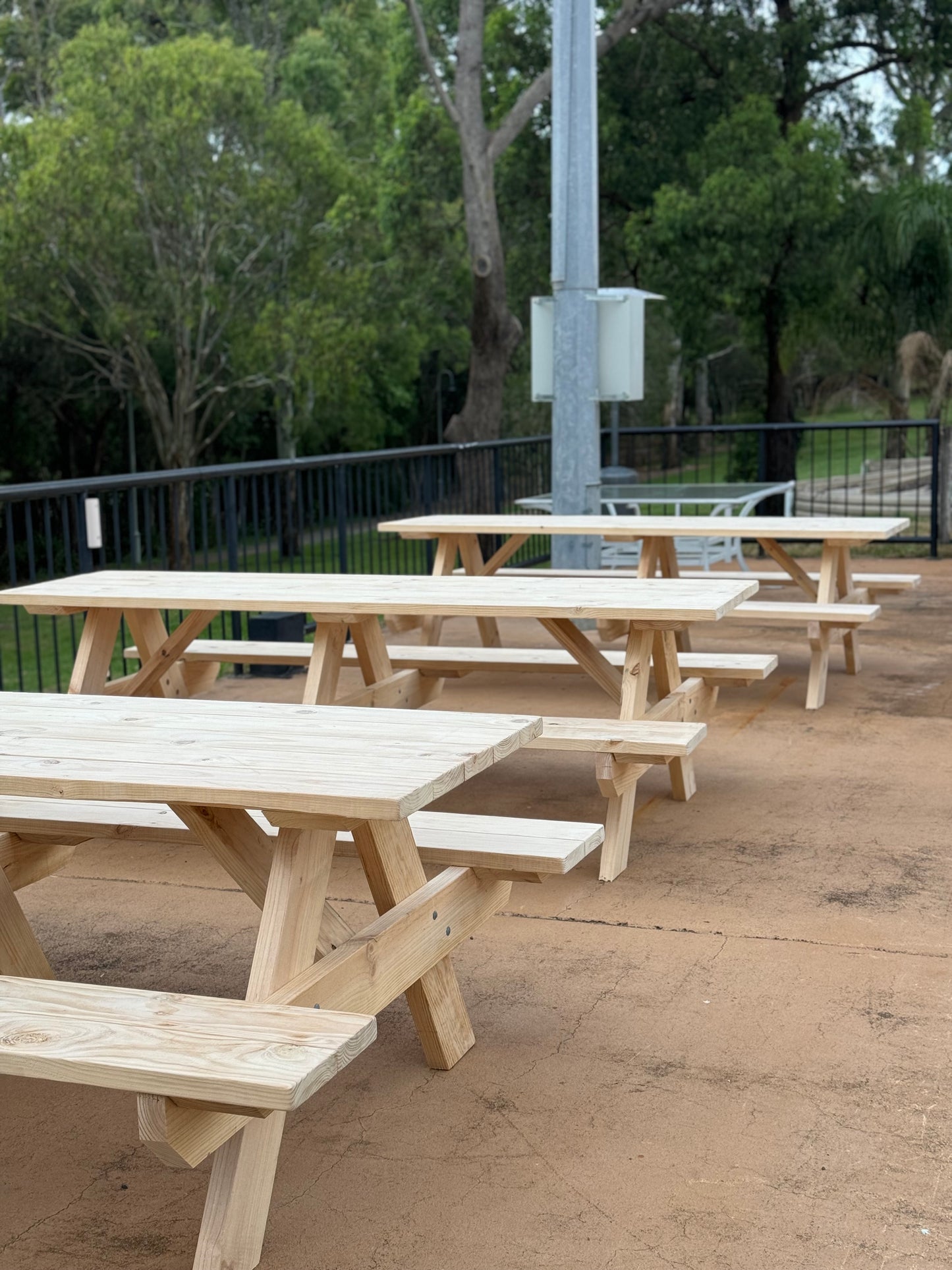 Natural timber picnic table with raw finish suited for botanical gardens and visitor outdoor rest areas in Australia