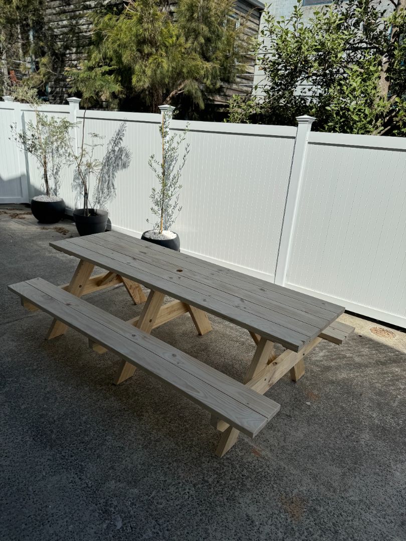 Raw timber heavy duty commercial picnic table with umbrella hole, built for shaded outdoor areas requiring durable construction and natural finish appeal in Australia