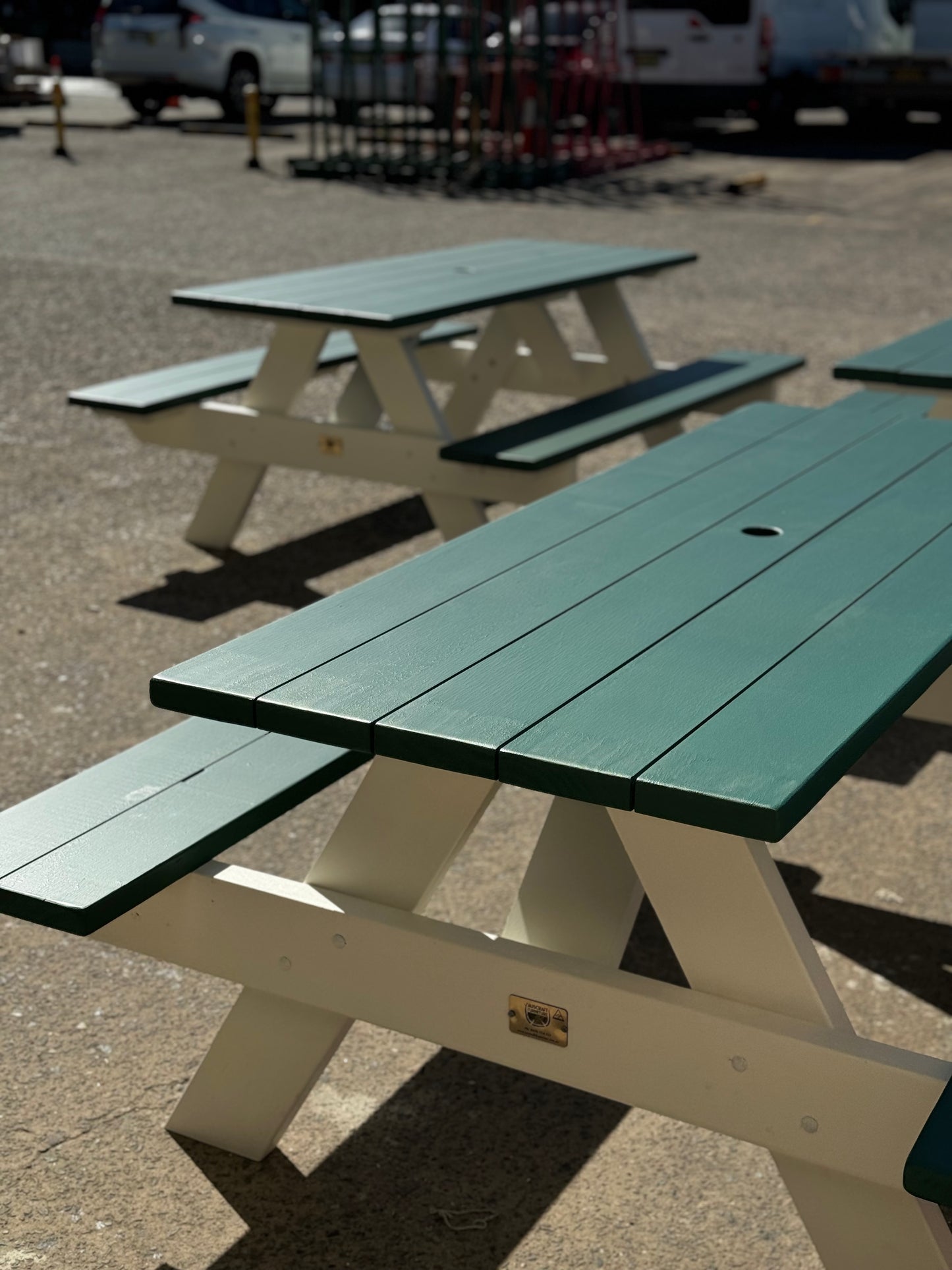 Commercial grade black picnic table with white base suitable for school outdoor lunch areas and student gathering spaces in Australia