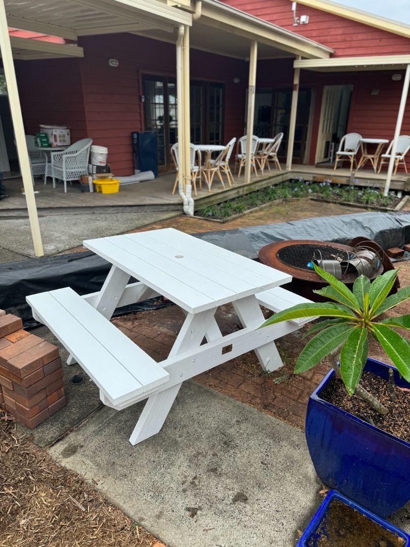 White heavy duty commercial picnic table with umbrella hole, designed for shaded outdoor seating areas that need durable, weather-resistant performance in Australia