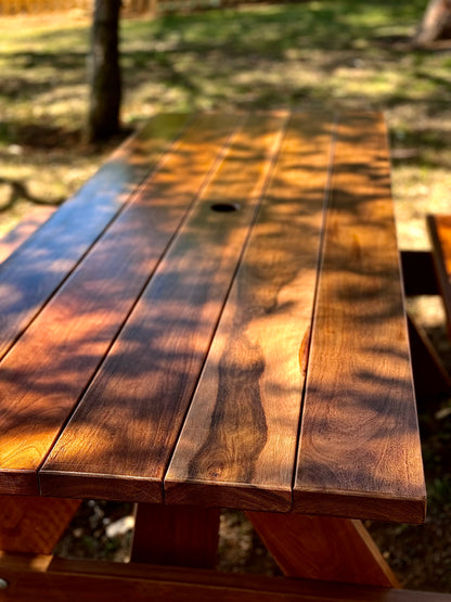 Natural walnut varnished hardwood picnic table offering strong outdoor performance for Australian backyards, cafés and patio areas.