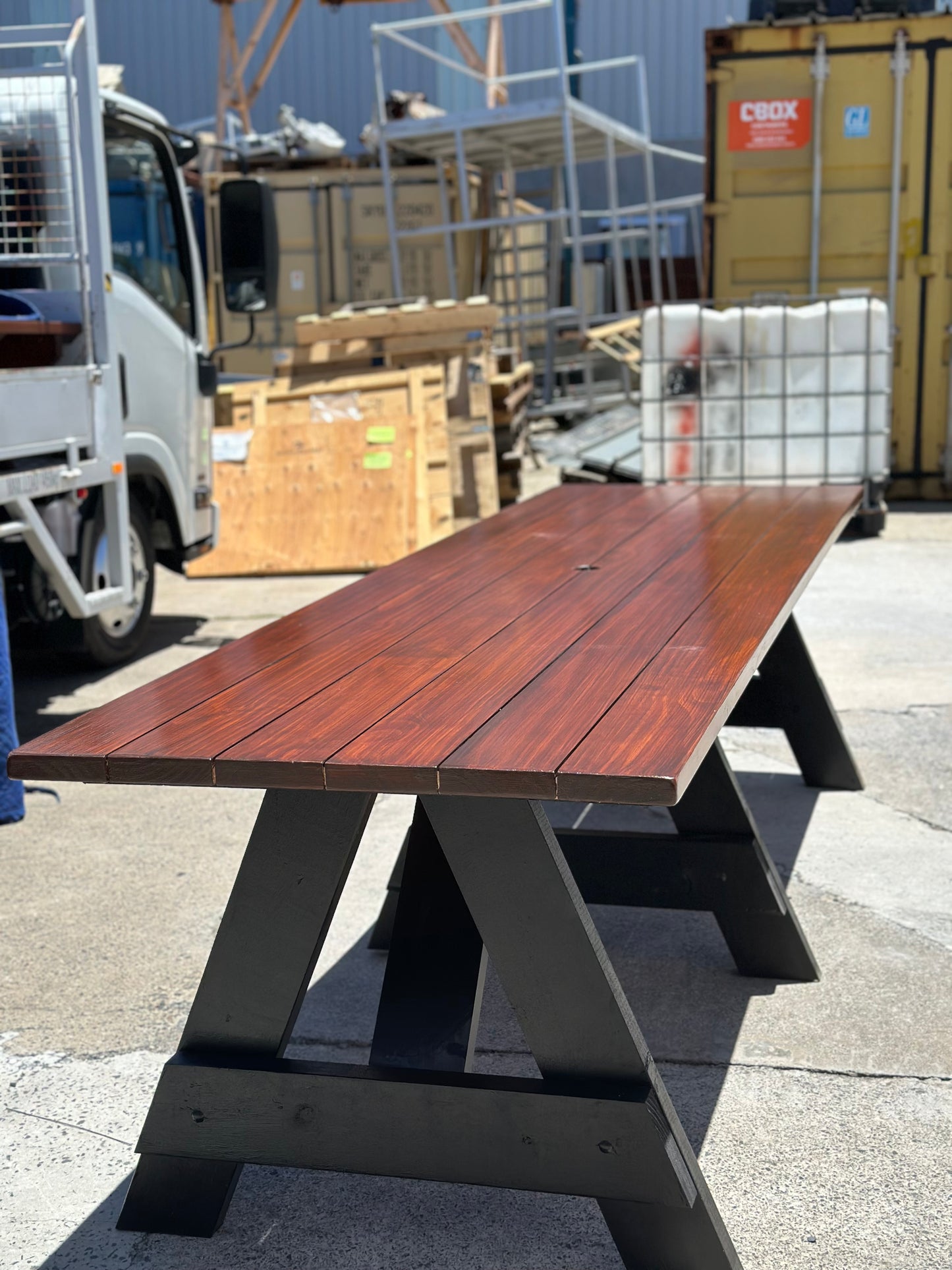 Walnut stain heavy-duty outdoor table designed for long-term outdoor use in Australia