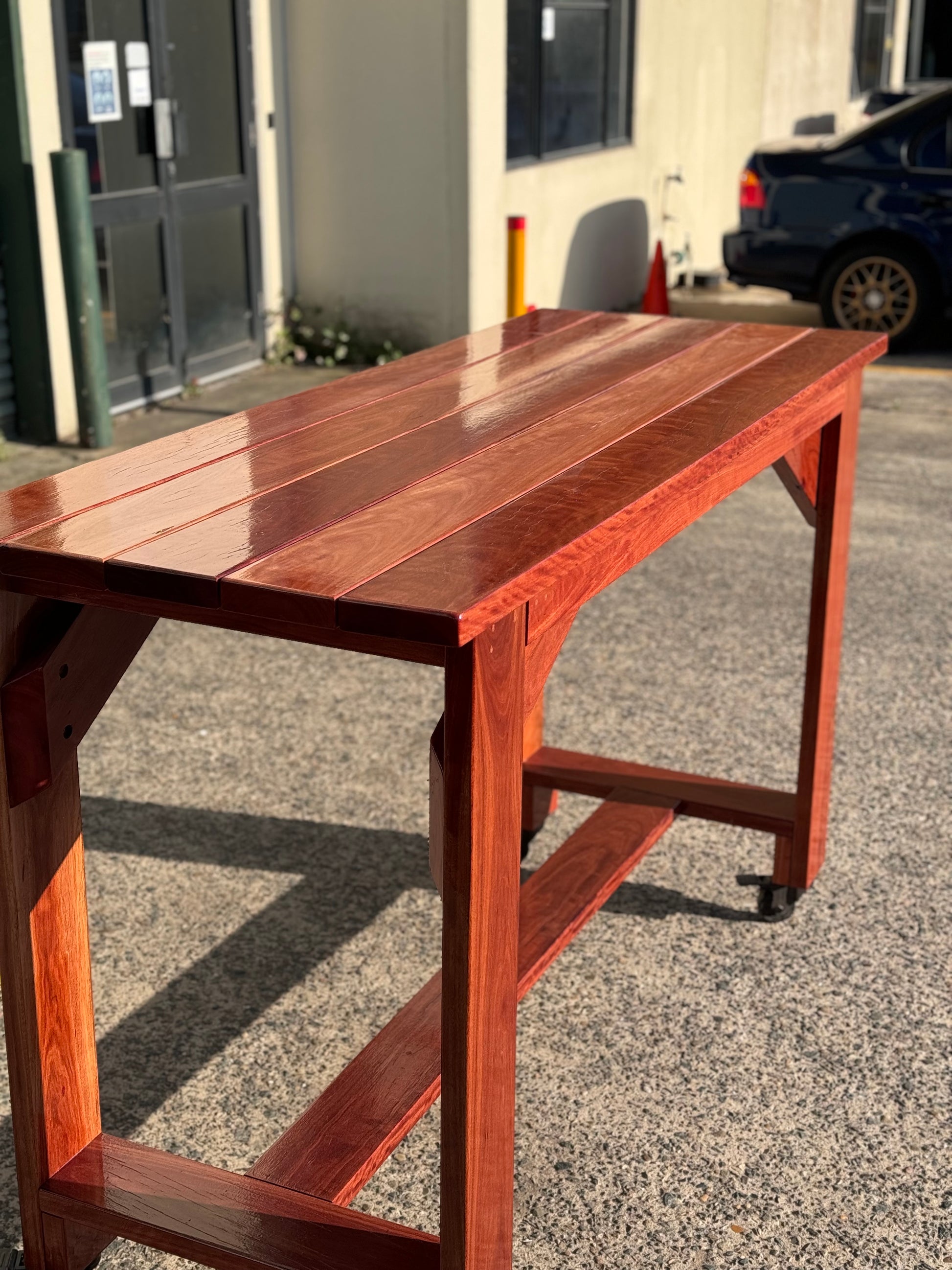 Custom painted solid wood high bar table designed for bespoke indoor and outdoor environments in Australia