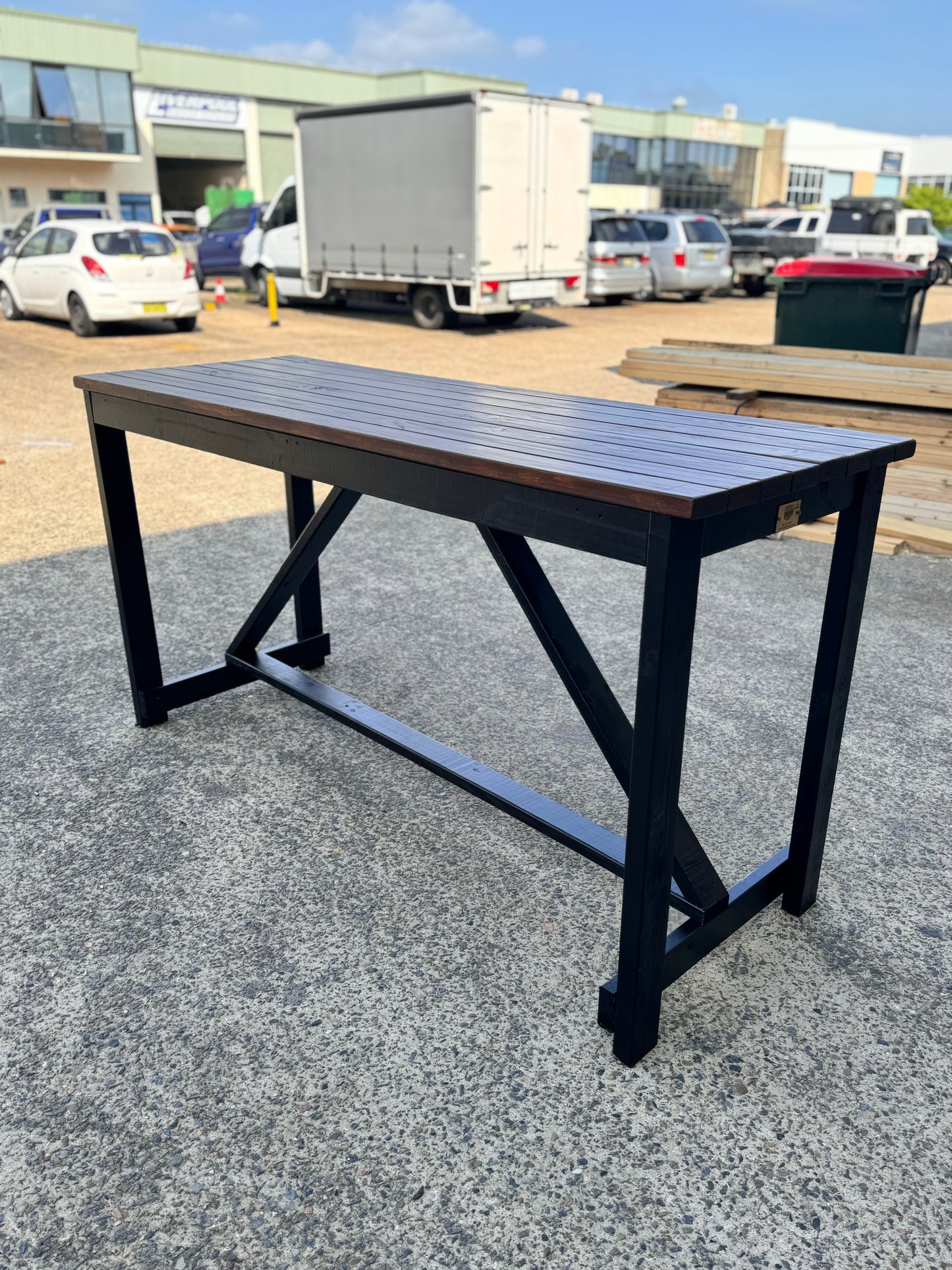 Premium solid wood high bar table with custom stain and black legs for backyard gardens and outdoor entertaining in Australia