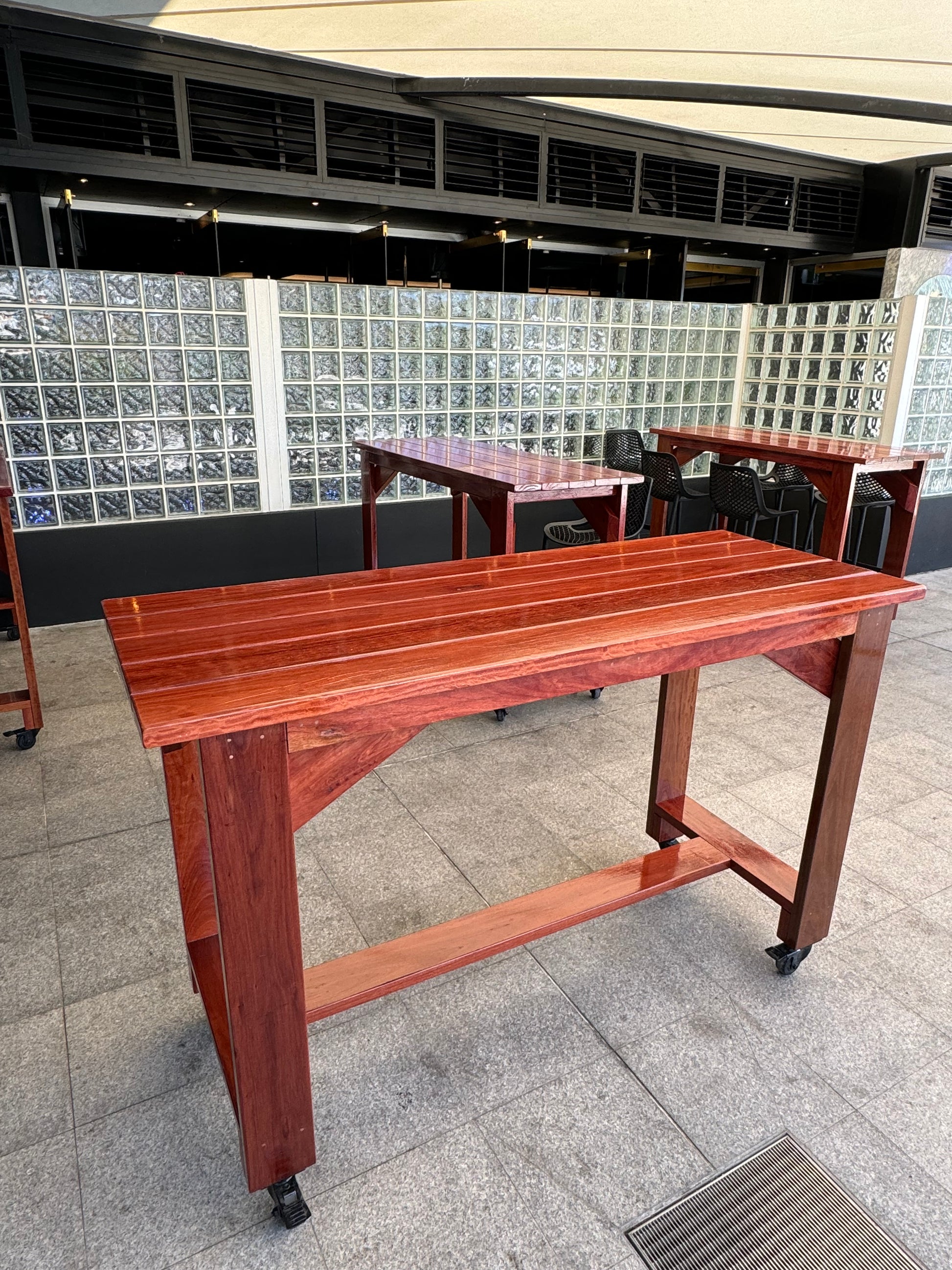 Full varnished solid wood high bar table, ideal for rooftop bars and outdoor lounges in Australia