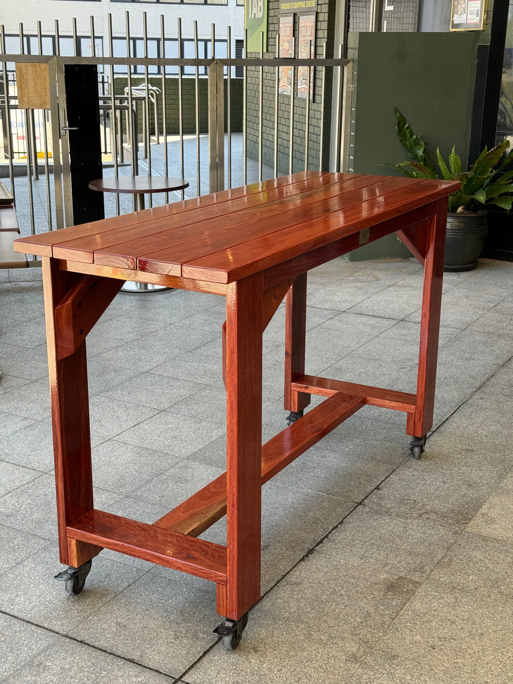 Raw solid wood high bar table showcasing natural timber finish for outdoor and indoor use in Australia