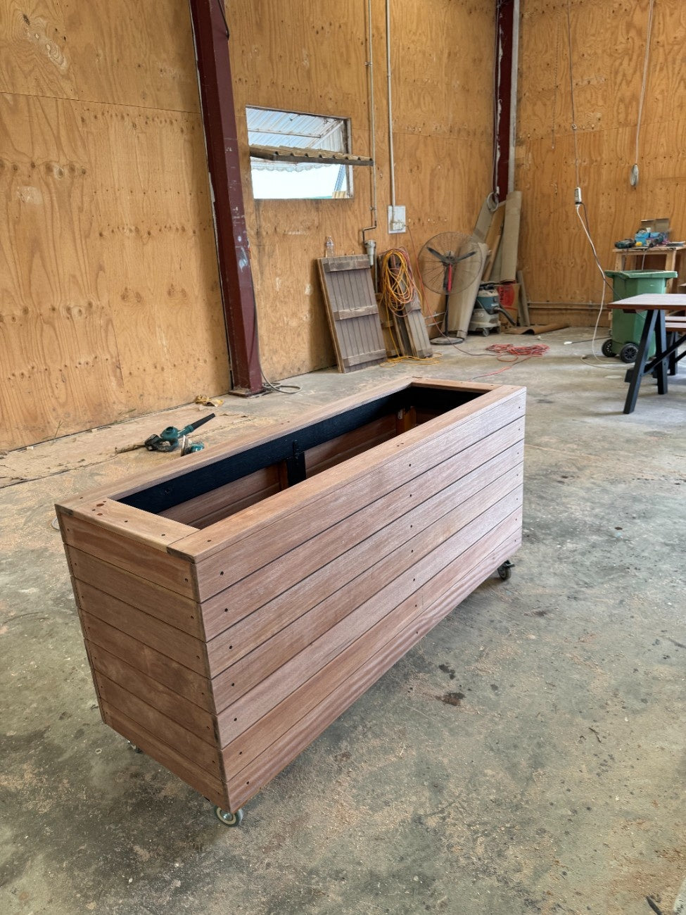Handcrafted traditional planter box in kiln-dried Jambu hardwood, perfect for hotel rooftop gardens and terraces, durable and stylish.