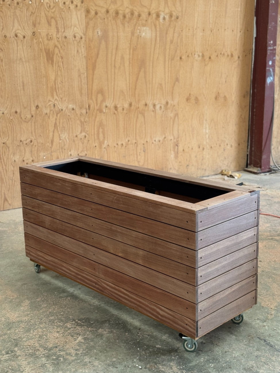 Handcrafted traditional planter box made from kiln-dried Jambu hardwood, perfect for restaurant patios and alfresco dining spaces.