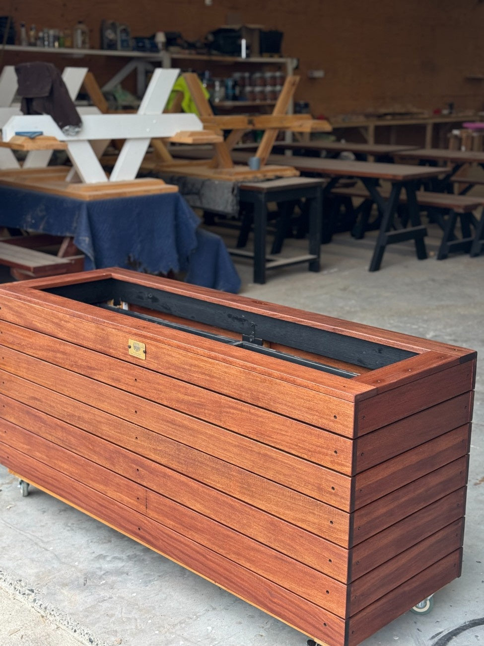 Durable traditional planter box crafted from kiln-dried Jambu hardwood, suitable for schools, universities, and childcare centres to add greenery to learning spaces.