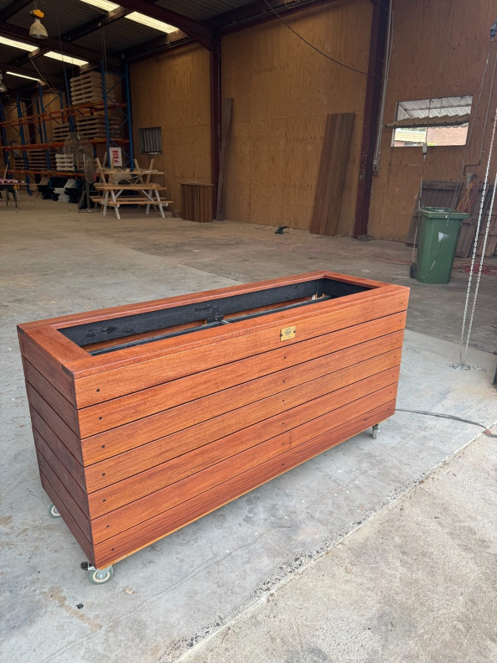 Handcrafted traditional planter box in kiln-dried Jambu hardwood, perfect for spa and wellness centre outdoor areas, adding natural elegance.
