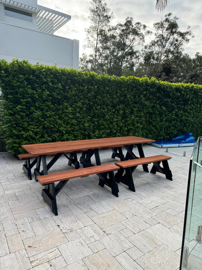 Walnut hardwood picnic table with black legs, highlighting natural timber grain and durable outdoor construction for Australian conditions